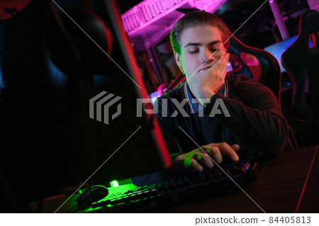 Cyber sport. Team play. Professional cybersport player training or playing online game on his PC 84405813