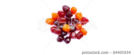 Close-up texture of red, orange and purple multivitamin gummies on white background. Healthy lifestyle concept 84405834
