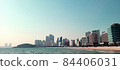 A view of Haeundae Beach in November with a view of Suyeong Bay Marine City skyscrapers and Dongbaek Island in the distance 84406031