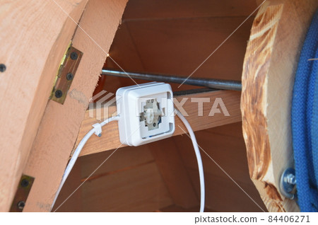 The work of an electrician to conduct electric light in offices and apartments 84406271