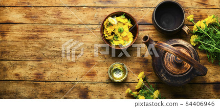 Glass teapot with flower tea,space for text Glass teapot with flower tea,space for text 84406946