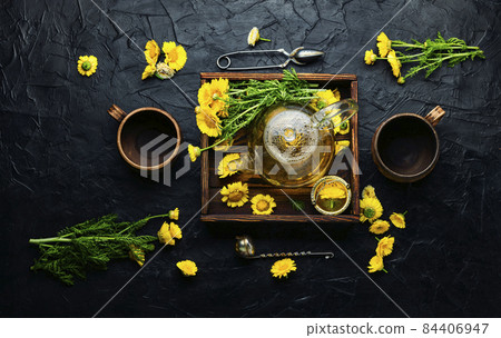 Glass teapot with flower tea,herbalism Glass teapot with flower tea,herbalism 84406947
