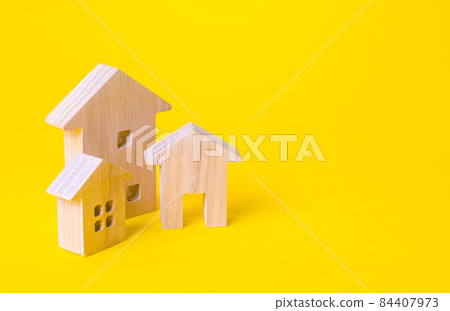 Residential buildings on a yellow background. Buying and selling real estate. Renting housing, realtor services. Renovation and home improvement. Mortgage loan. Building maintenance. 84407973