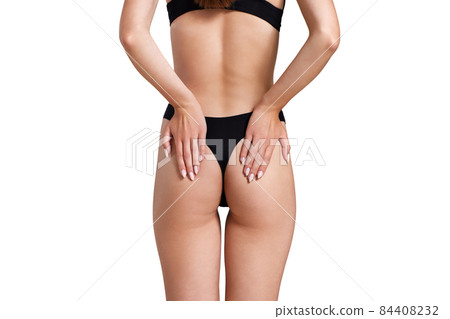 Perfect buttocks of young woman in black underwear Perfect buttocks of young woman in black underwear 84408232