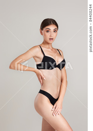 gorgeous slim woman with perfect body in black underwear 84408244