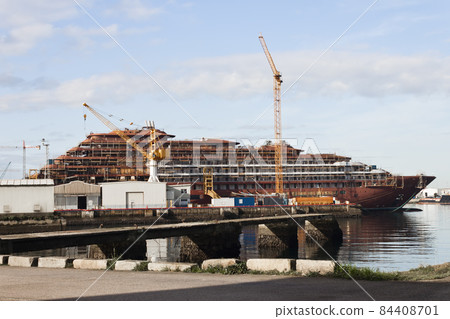 Construction of a ship in the shipyard of Vigo with cranes and scaffolds Construction of a ship in the shipyard of Vigo with cranes and scaffolds 84408701
