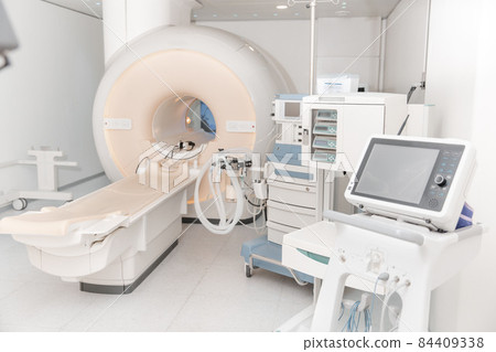 Medical CT or MRI Scan in the modern hospital laboratory. Interior of radiography department. Technologically advanced equipment in white room. Magnetic resonance diagnostics machine. Medical CT or MRI Scan in the modern hospital laboratory. Interior of radiography department. Technologically advanced equipment in white room. Magnetic resonance diagnostics machine. 84409338