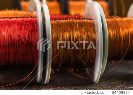 Row of magnetic copper wire coils 84409984