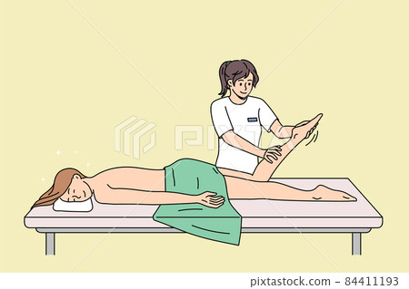 Happy client relax on table in massage saloon Happy client relax on table in massage saloon 84411193