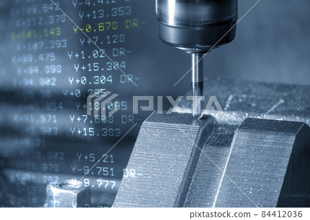 The abstract scene CNC milling machine cutting the mold and die parts and G-code data background. The abstract scene CNC milling machine cutting the mold and die parts and G-code data background. 84412036