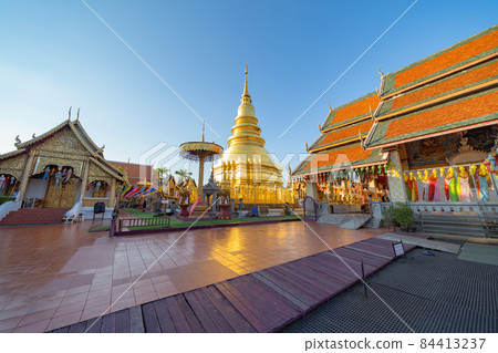 Traditional festival in Harikulchai Temple, Lamphun, Thailand in holidays vacation. Ceremony in Asia. Celebration. Thai architecture. Tourist attraction landmark. 84413237