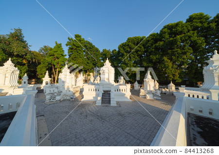 White pagoda or stupa of Wat Suan Dok buddhist Temple, Chiang Mai City, Thailand. Thai architecture. Tourist attraction landmark. 84413268