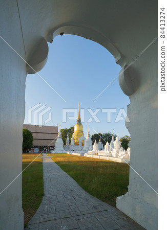 White pagoda or stupa of Wat Suan Dok buddhist Temple, Chiang Mai City, Thailand. Thai architecture. Tourist attraction landmark. 84413274
