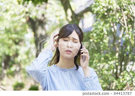 Female call outdoors worried 84413787