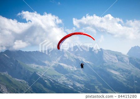 paragliding flight in the mountains. Le Grand-Bornand, France 84415280