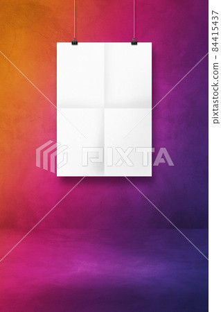 White folded poster hanging on a purple wall with clips White folded poster hanging on a purple wall with clips 84415437