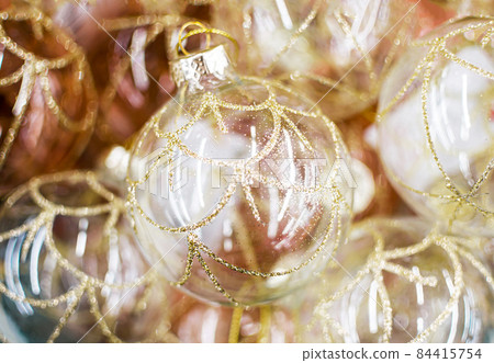 Golden Glass Christmas balls close up, tree toys, soft focus 84415754