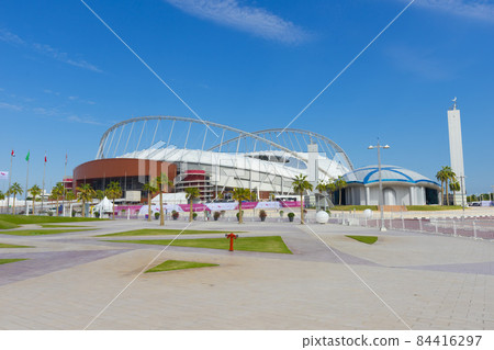 Entrance of Khalifa National Stadium against blue sky in Doha, Qatar 84416297