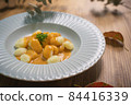 Autumn table photo of gnocchi with uni sauce 84416339