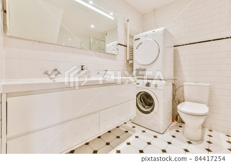 Adorable bathroom with laundry area and large sink for two 84417254
