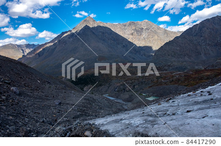 Glacier on the background of mountain peaks in the Altai Republic. Glacier on the background of mountain peaks in the Altai Republic. 84417290