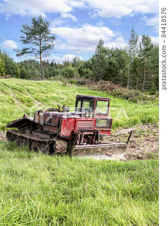 Old skidder at the outdoors in summertime Old skidder at the outdoors in summertime 84418576