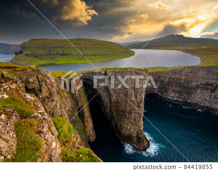 Sunset at Sorvagsvatn or Leitisvatn lake in the island of Vagar. Faroe Islands. Sunset at Sorvagsvatn or Leitisvatn lake in the island of Vagar. Faroe Islands. 84419855