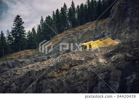 picture of mining in a quarry with demolition equipment, industrial photography, mining and environmental destruction 84420439