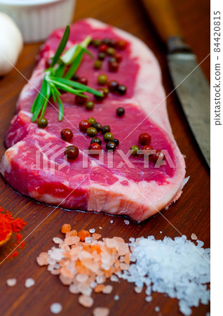 raw uncooked  ribeye beef steak butcher selection 84420815