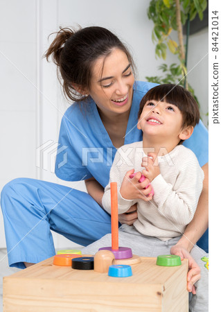 Disabled child is playing, learning and exercising in rehabilitation therapy hospital, Lifestyle of 84421014