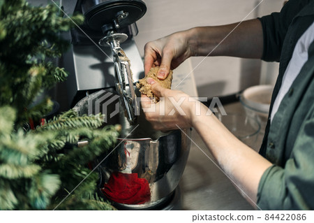 Cooking dough for gingerbread. Products and ingredients on kitchen table ready for making Christmas gingerbread. Making Christmas gingerbread at home. 84422086