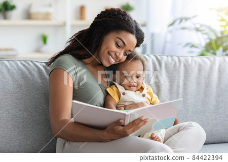 Early Development Concept. Loving Black Mom Reading Book To Her Toddler Kid Early Development Concept. Loving Black Mom Reading Book To Her Toddler Kid 84422394