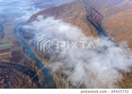 Foggy morning in the mountains forest mountain tops Foggy morning in the mountains forest mountain tops 84425732
