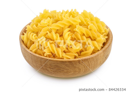 raw Fusilli pasta in wooden bowl isolated on white background with clipping path and full depth of field 84426334