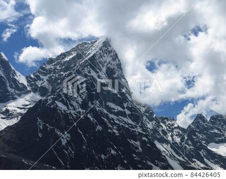 Mount Cholatse on a cloudy day. Mount Cholatse on a cloudy day. 84426405