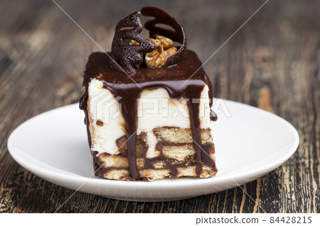 chocolate cream cake with sponge cake 84428215