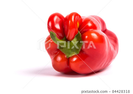 Ugly shaped organic vegetables. Deformed homegrown bell pepper isolated. white background Ugly shaped organic vegetables. Deformed homegrown bell pepper isolated. white background 84428318