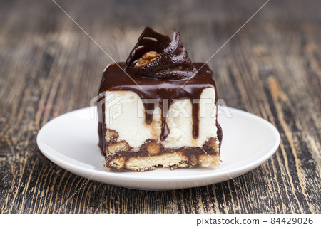 cube shaped cake on a plate 84429026