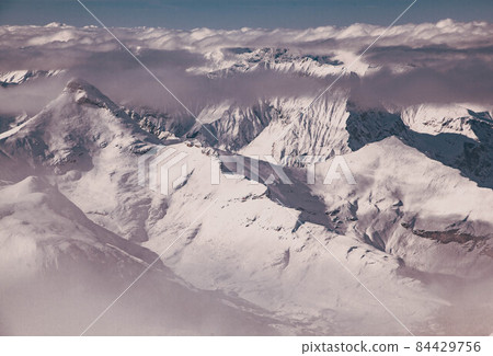 amazing snow covered peaks in the Swiss alps Jungfrau region from Schilthorn 84429756