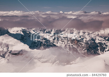 amazing snow covered peaks in the Swiss alps Jungfrau region from Schilthorn 84429760