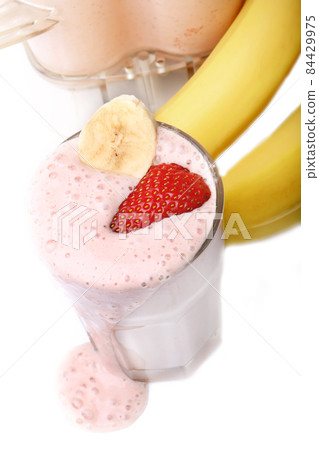 banana and strawberry smoothie on white background banana and strawberry smoothie on white background 84429975