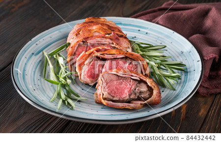 Bacon-wrapped beef steack 84432442