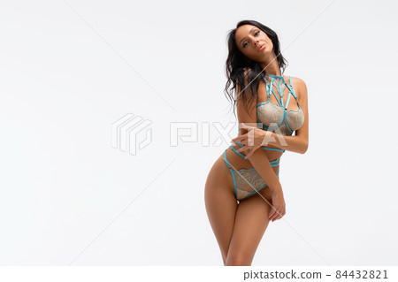 Tempting woman in lace lingerie in studio Tempting woman in lace lingerie in studio 84432821