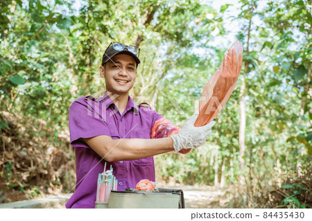 veterinarians are preparing the tools for artificial insemination of cow. veterinarians are preparing the tools for artificial insemination of cow. 84435430