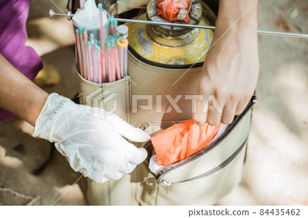 hand preparing the tools for artificial insemination of cow. hand preparing the tools for artificial insemination of cow. 84435462