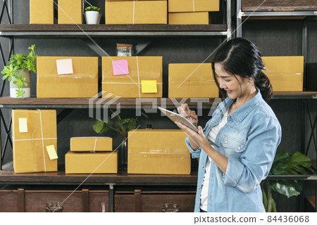 Online seller Close up hands Young asian woman typing laptop keyboard checking online order, check goods stock delivery package shipping postal. Asian woman startup small business at home office Online seller Close up hands Young asian woman typing laptop keyboard checking online order, check goods stock delivery package shipping postal. Asian woman startup small business at home office 84436068