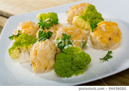 Norwegian cuisine fish balls with tasty white fish served with brokkoli at plate 84436088