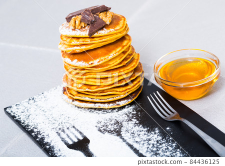 Pancakes with honey and chocolate Pancakes with honey and chocolate 84436125