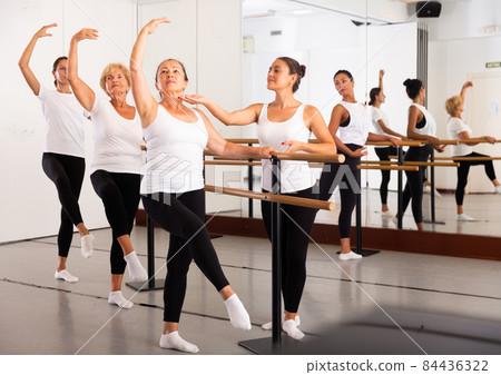 Group of women training ballet moves Group of women training ballet moves 84436322