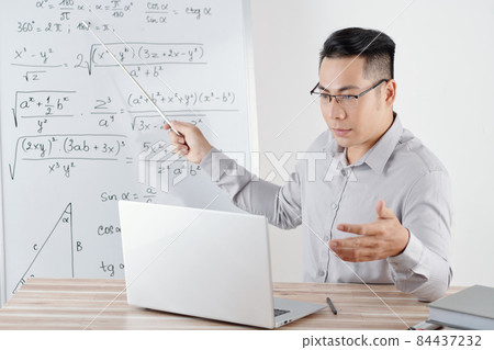 Math Teacher Pointing at Whiteboard Math Teacher Pointing at Whiteboard 84437232